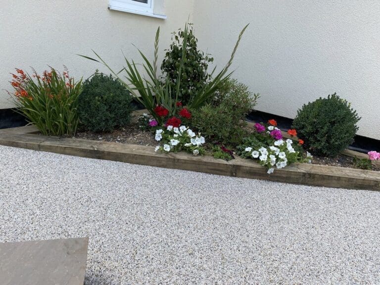 Resin Driveway installation for a house with plant area